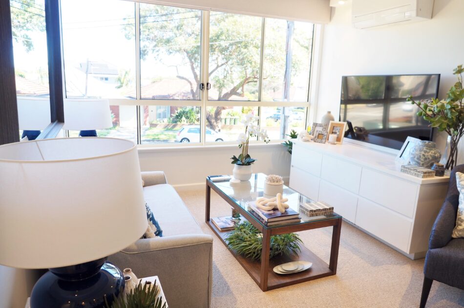 240906 Maroubra Unit 20 Living area with TV and view large windows 002